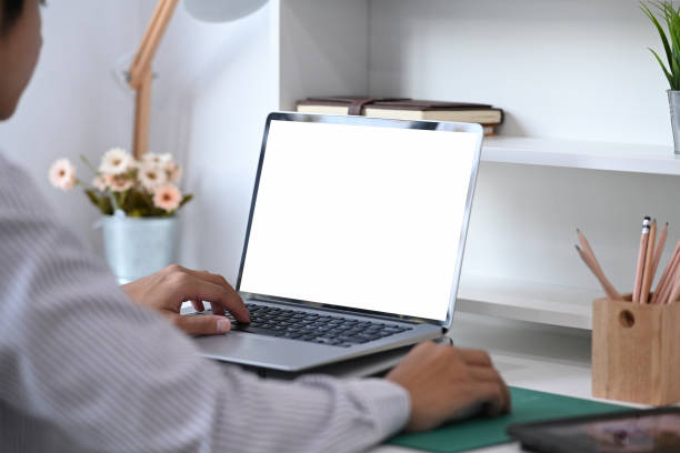 istock A creative designer man is working on laptop with blank screen in office. 1289157861