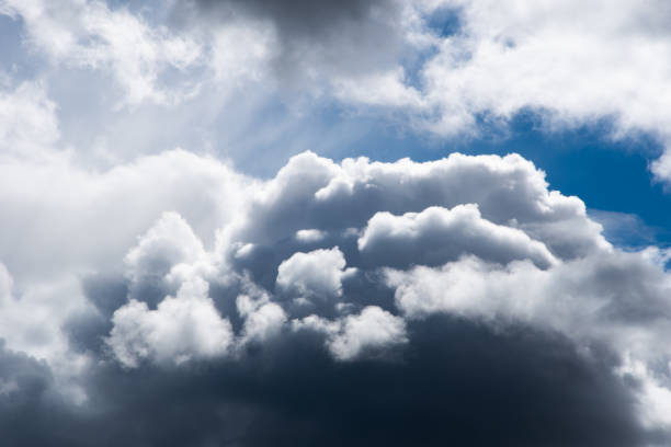istock Thunderstorm contrasting cloud, blue sky and white cumulus clouds. Can be used as design element, background 1289158191