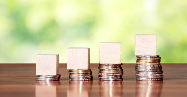 istock Empty wooden cube block on steps made with coin. Growth 1289158471