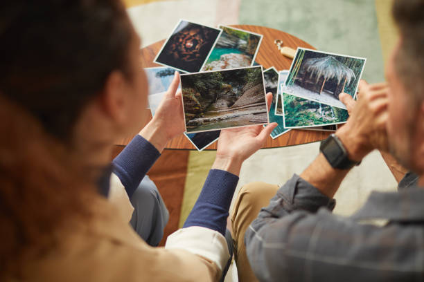 istock Couple looking at their photos 1289159819