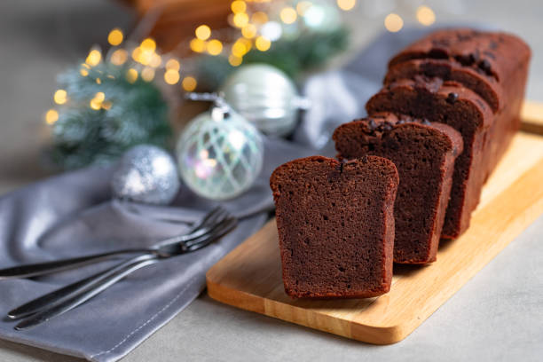 istock Slices of chocolate cake on gray Christmas table. 1289159855