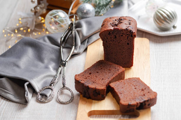 istock Slices of chocolate cake on gray Christmas table. 1289159870