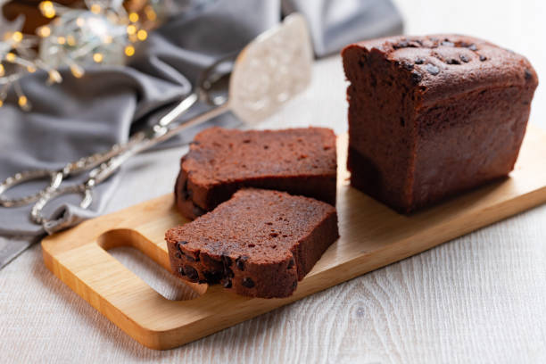 istock Slices of chocolate cake on gray Christmas table. 1289159882