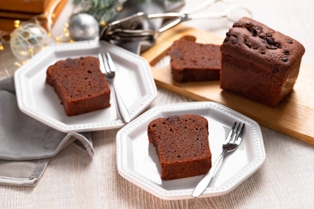 istock Slices of chocolate cake on gray Christmas table. 1289159905