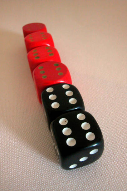 istock black and red dice showing the number six 1289160828