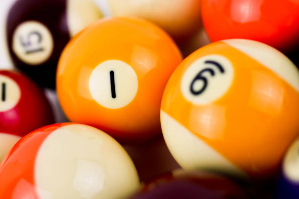 istock Brightly colored pool or billiard balls close up on white background 1289161262