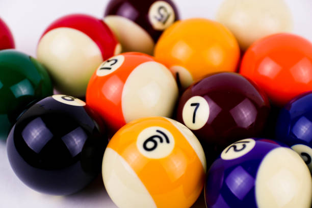 istock Brightly colored pool or billiard balls close up on white background 1289161307