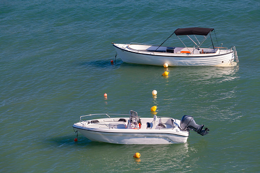Two pleasure motor boats are anchored near Greek island Zakynthos, Ionian Sea