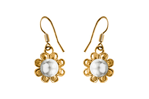 Vintage gold flower shaped earrings with white pearl isolated over white