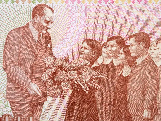 Mustafa Kemal Ataturk with a children a portrait from Turkish money - Lira