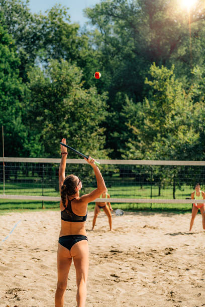 istock Beach Tennis Player Serving the Ball 1289165003