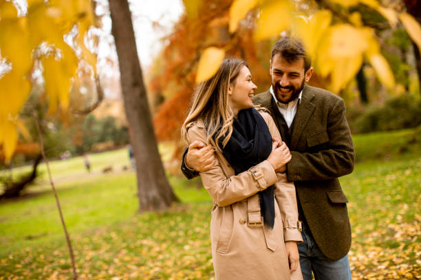 istock Young couple in the autumn park 1289166673
