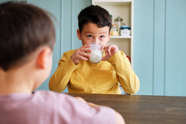 istock Cute child drinking milk for healthy bones 1289167526