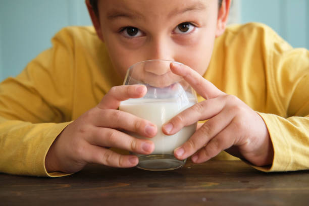 istock Cute child drinking milk for healthy bones 1289167547