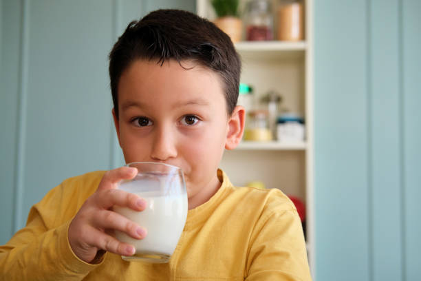 istock Cute child drinking milk for healthy bones 1289167580
