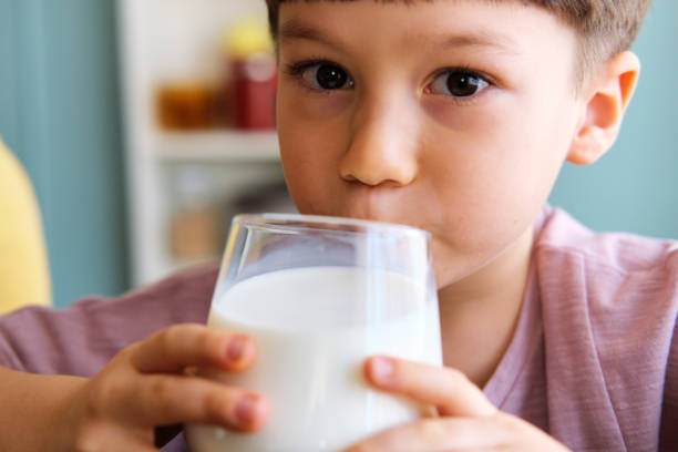 istock Cute child drinking milk for healthy bones 1289167583