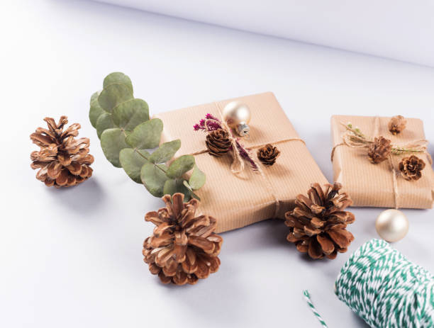 istock Christmas festive wrapped presents, pine cones 1289167623