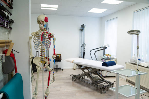istock Medical cabinet for physiotherapywith massage couch and skeleton 1289167636
