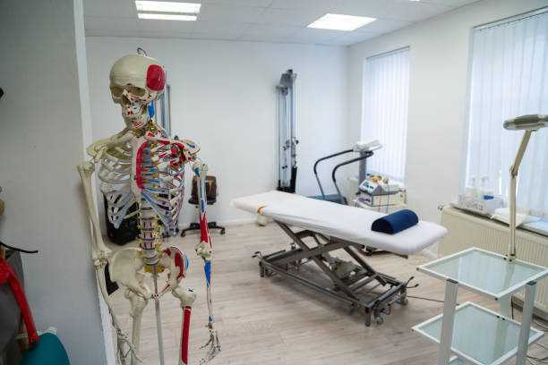 istock Medical cabinet for physiotherapywith massage couch and skeleton 1289167642