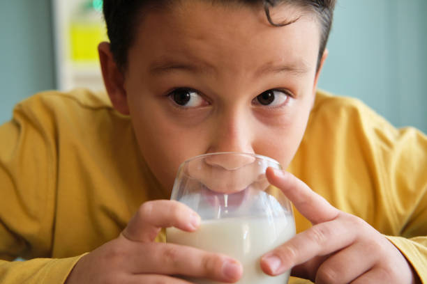 istock Cute child drinking milk for healthy bones 1289167789