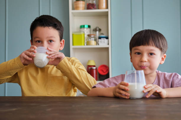 istock Cute child drinking milk for healthy bones 1289167822