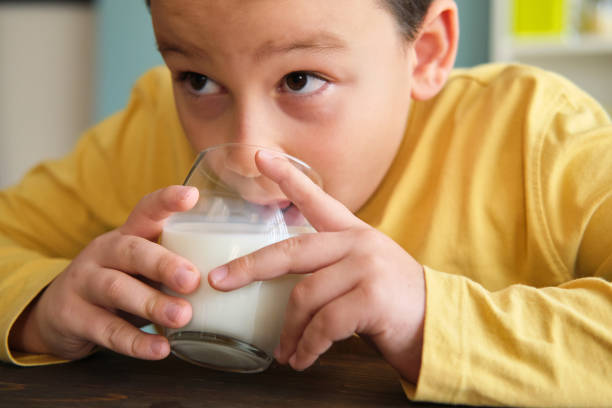 istock Cute child drinking milk for healthy bones 1289167950