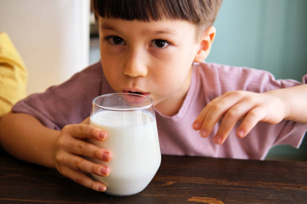 istock Cute child drinking milk for healthy bones 1289168030