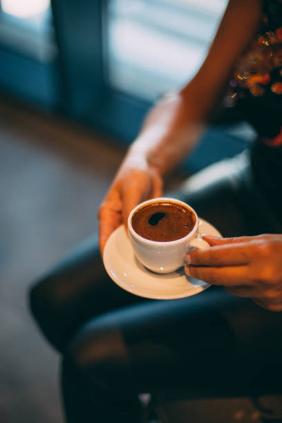 istock Woman Sitting and Drinking Turkish Coffee 1289168141