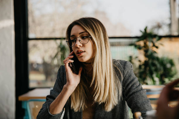 istock Female designer talking on the phone 1289169397