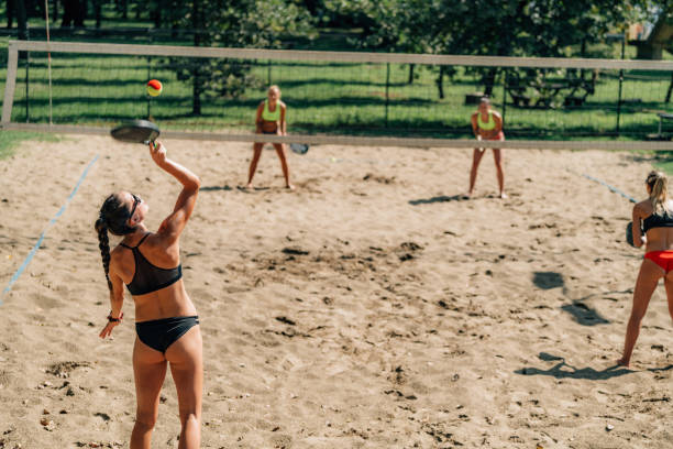 istock Beach Tennis Player Serving the Ball 1289170153