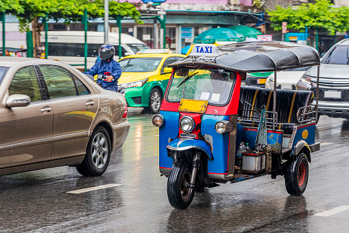 Typical colorful tuk tuk parked in Bangkok Thailand.
