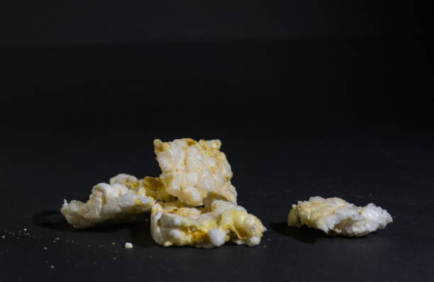 istock Grain crispbreads crispy rice diet whole grain bread. Rice cake puffed rice on black background 1289173726