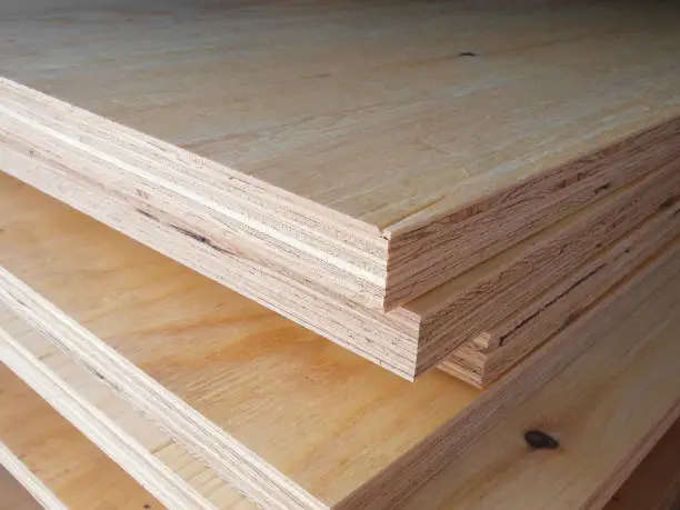 piles of pine plywood lie on top of each other