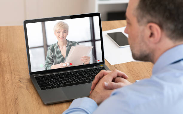 istock Unrecognizable man having videocall with his business partner, using laptop 1289177333