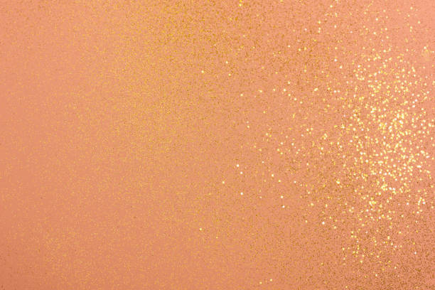 istock Light coral background with golden glitter. 1289179528