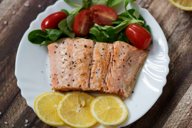 istock Salmon in a pan with lemon and other vegetables. 1289182213