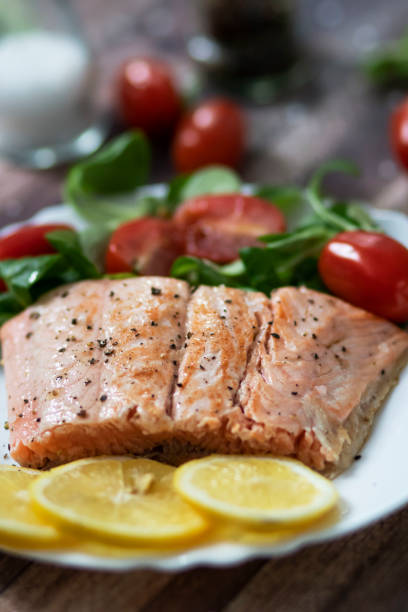 istock Salmon in a pan with lemon and other vegetables. 1289182225