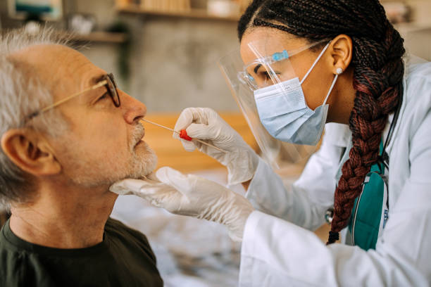 istock Doctor in a home visit to a senior man 1289182617