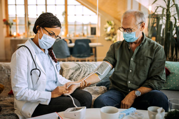 istock Professional nurse checking patient's blood pressure 1289186239