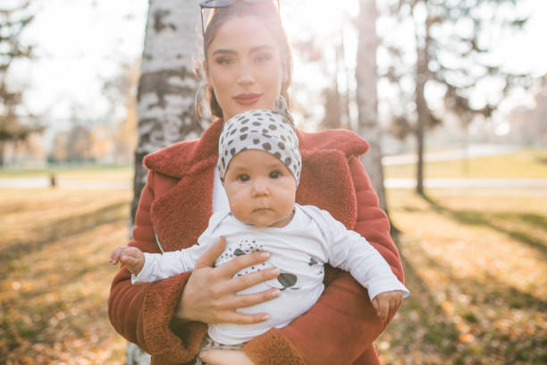 istock Mother and her baby walking in park 1289186277