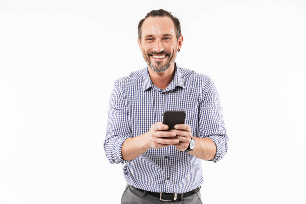 istock Cheerful adult man using mobile phone. 1289187591