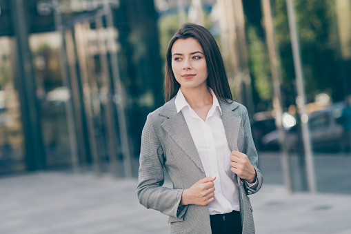 Photo of thoughtful serious attractive young businesswoman imagine think career chief in outdoors.