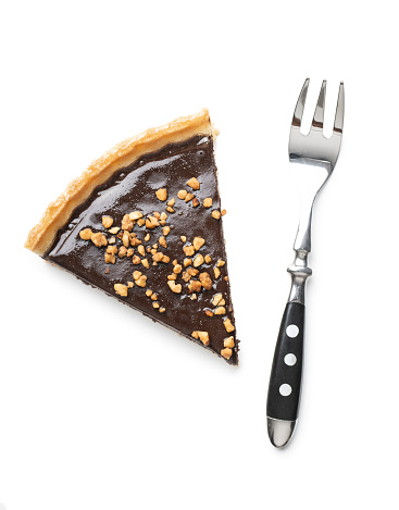 Sweet chocolate pie with crushed nuts isolated on white background.