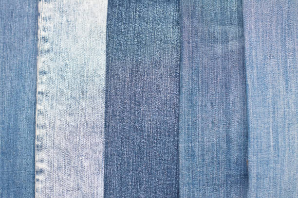 istock stack of various shades of blue jeans as background 1289190098