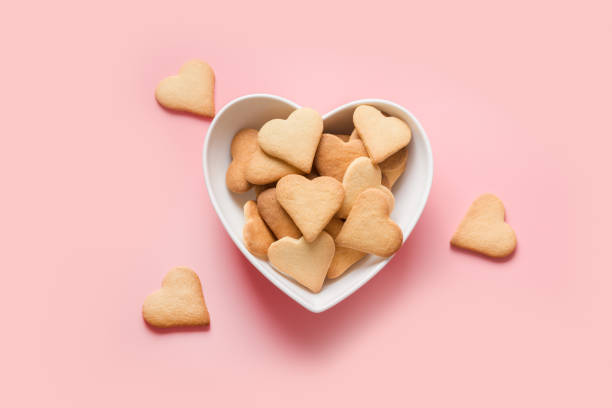 istock Valentines day card with heart shaped cookies on white. View from above. 1289190192