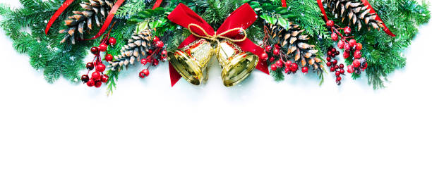 istock Decoration from snowy pine branches, cones, holly and Christmas bells 1289191316