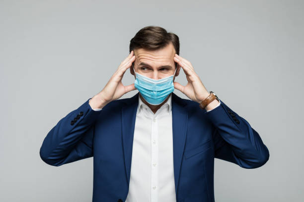 istock Worried manager wearing protective face mask 1289195327