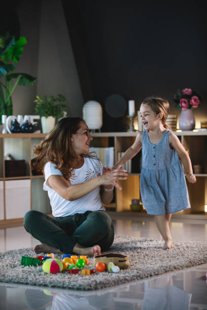 istock Happy daughter running around her mother 1289195665
