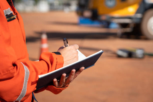 istock Writing note in safety inspection and audit. 1289195863