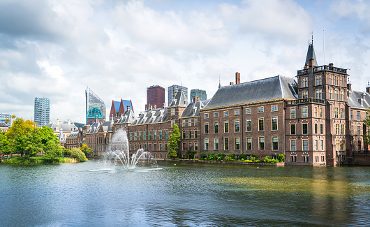 Frederiksborg Castle in Denmark with Neptune Fountain in front. Palace from early 17th century. Blue sky image. Copenhagen, Denmark - September 29, 2022.